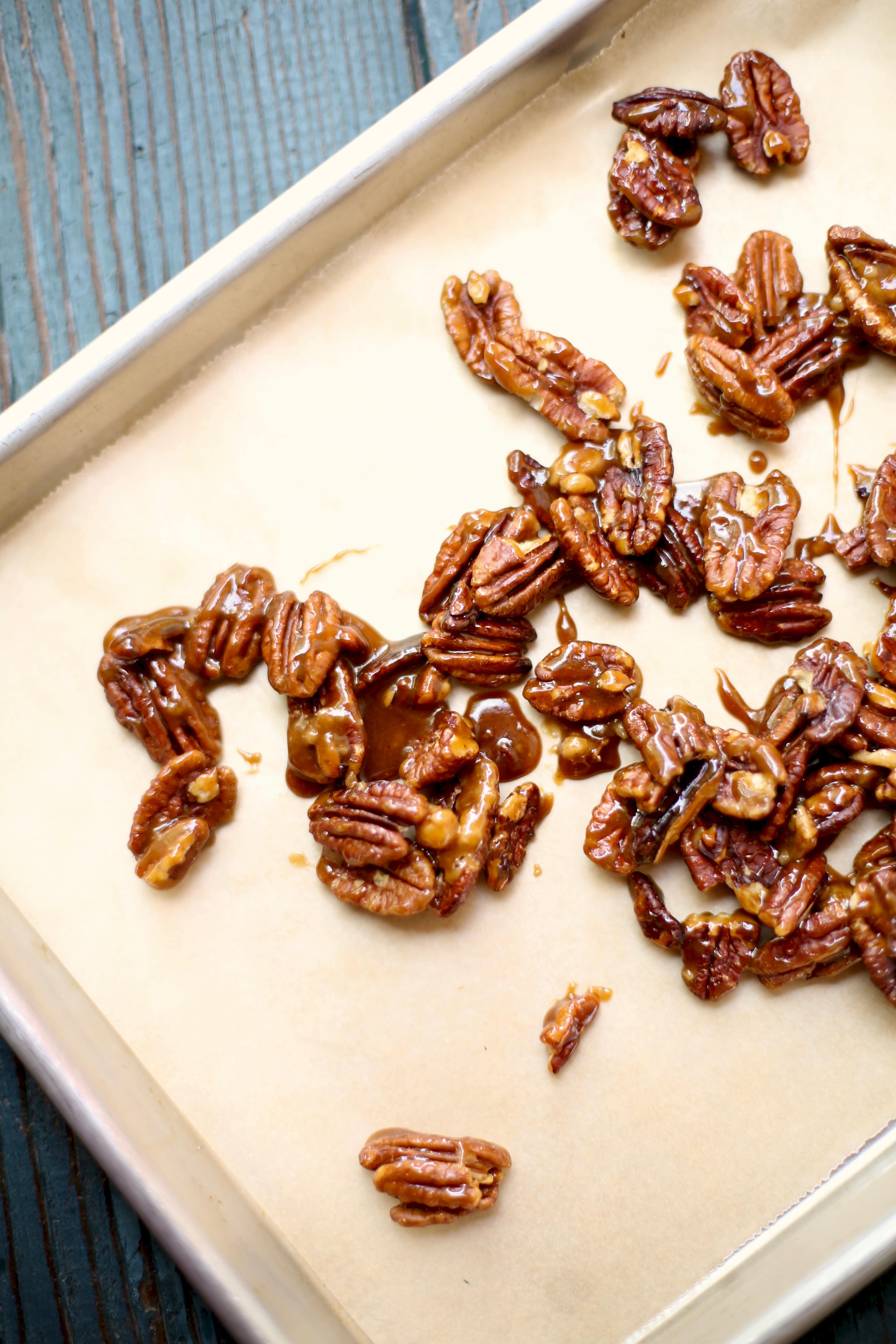 caramelized nuts on a baking sheet