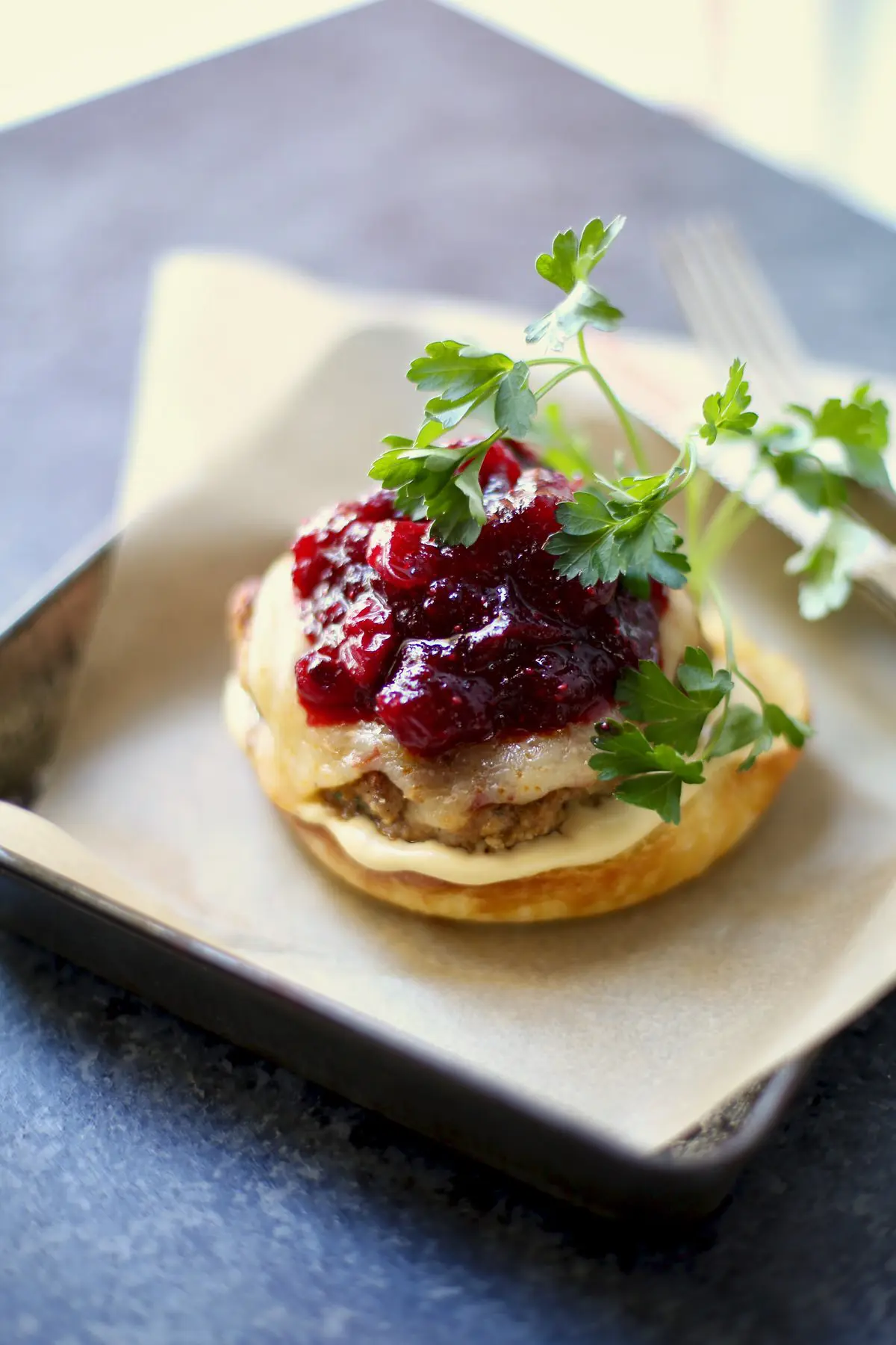 turkey burger on a tray with paper