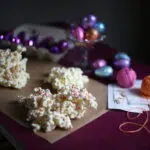 popcorn on a table with purple eggs