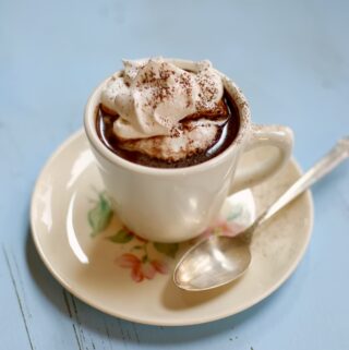 hot chocolate in a white cup and saucer