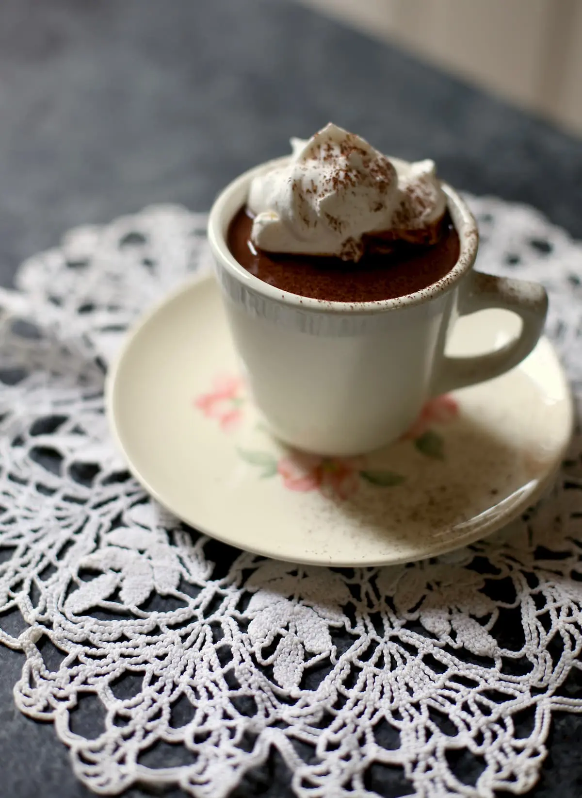 hot chocolate on a white doily