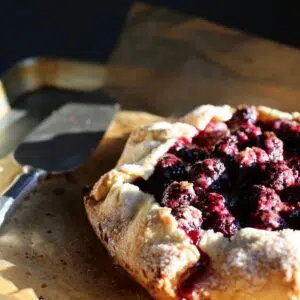 a blackberry galette on a baking sheet.