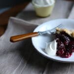 piece of pie on a plate with whipped cream