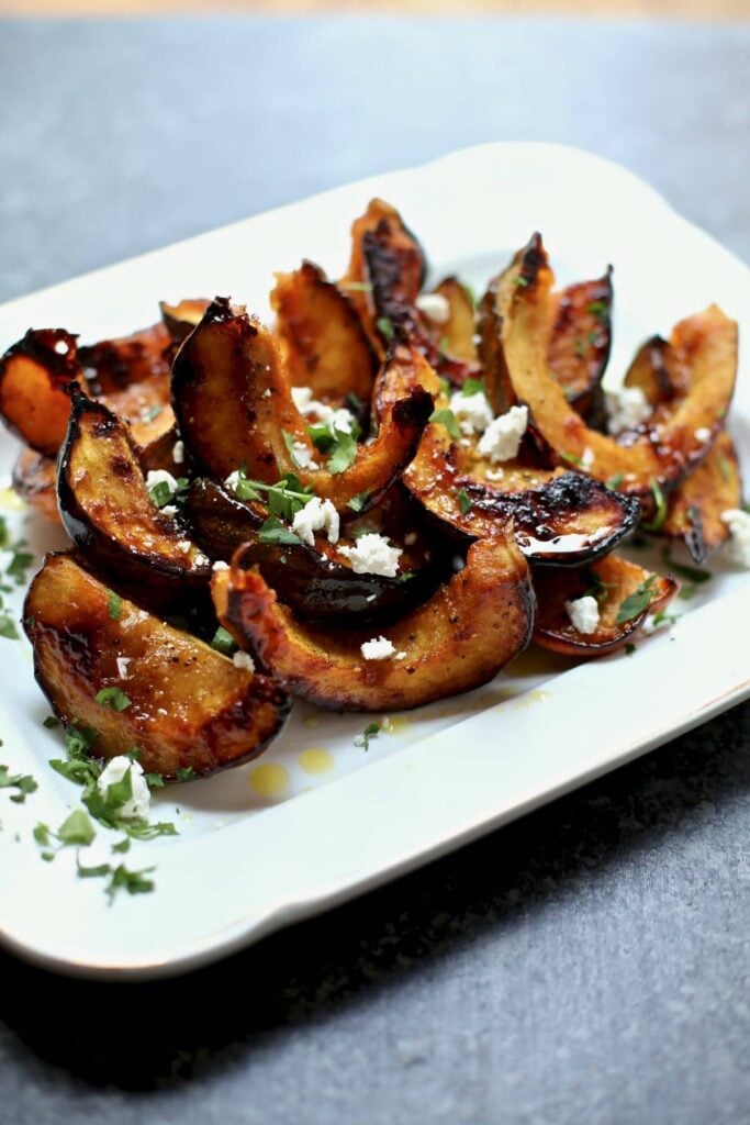 roasted squash on a white platter 