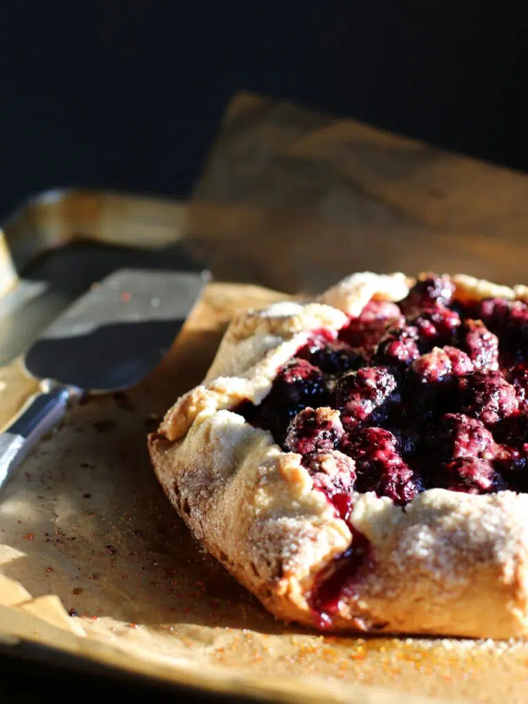 a blackberry galette on a baking sheet.