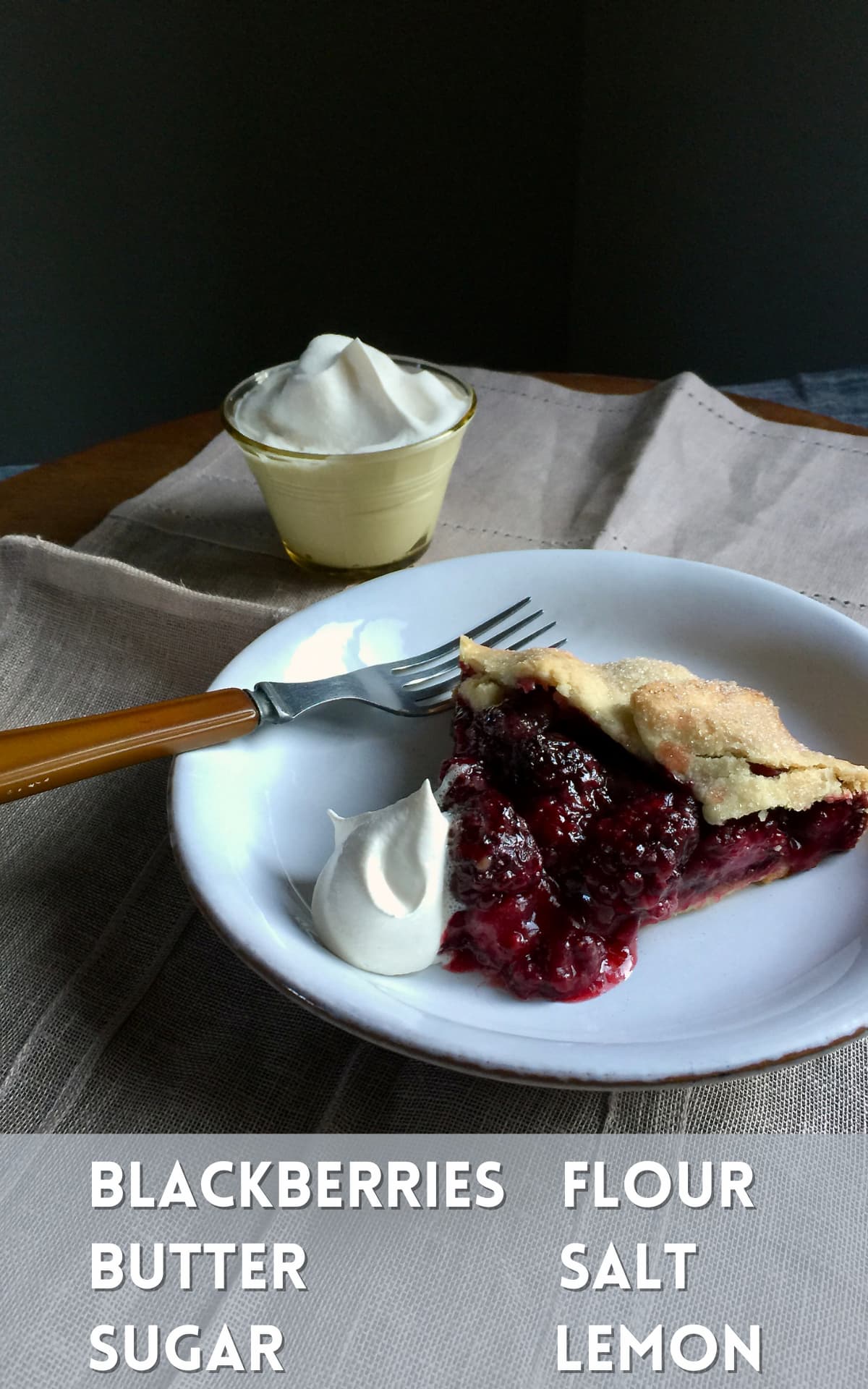 a piece of berry pie on a white plate with whipped cream. A text overlay on the bottom says what the key ingredients are to make the recipe.
