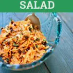 Carrot salad in a blue glass bowl bowl