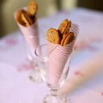 small cookies in a pink cone in a glass