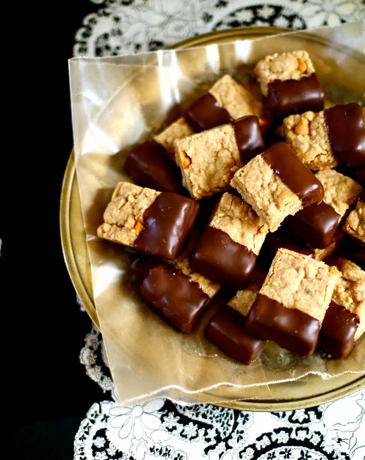 a tray of cookies on a gold platter.