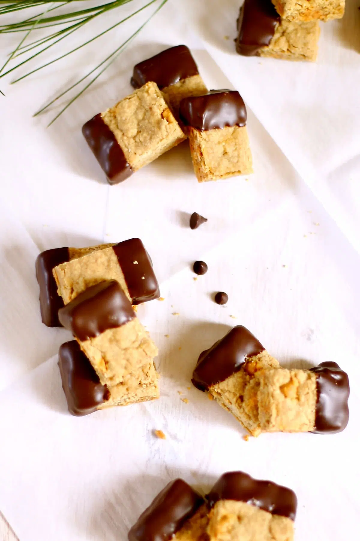 a grouping of cookies on a white table.