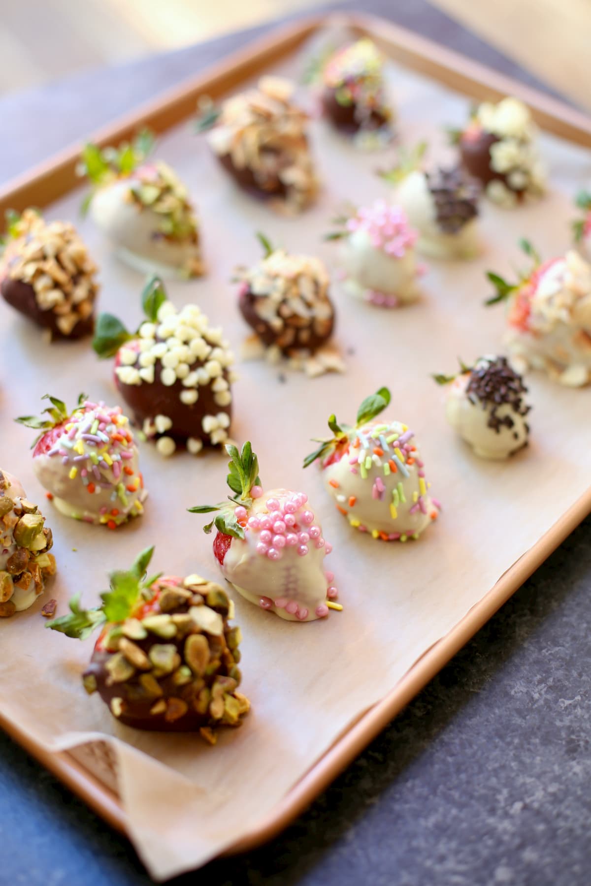 chocolate dipped strawberries on a baking sheet 