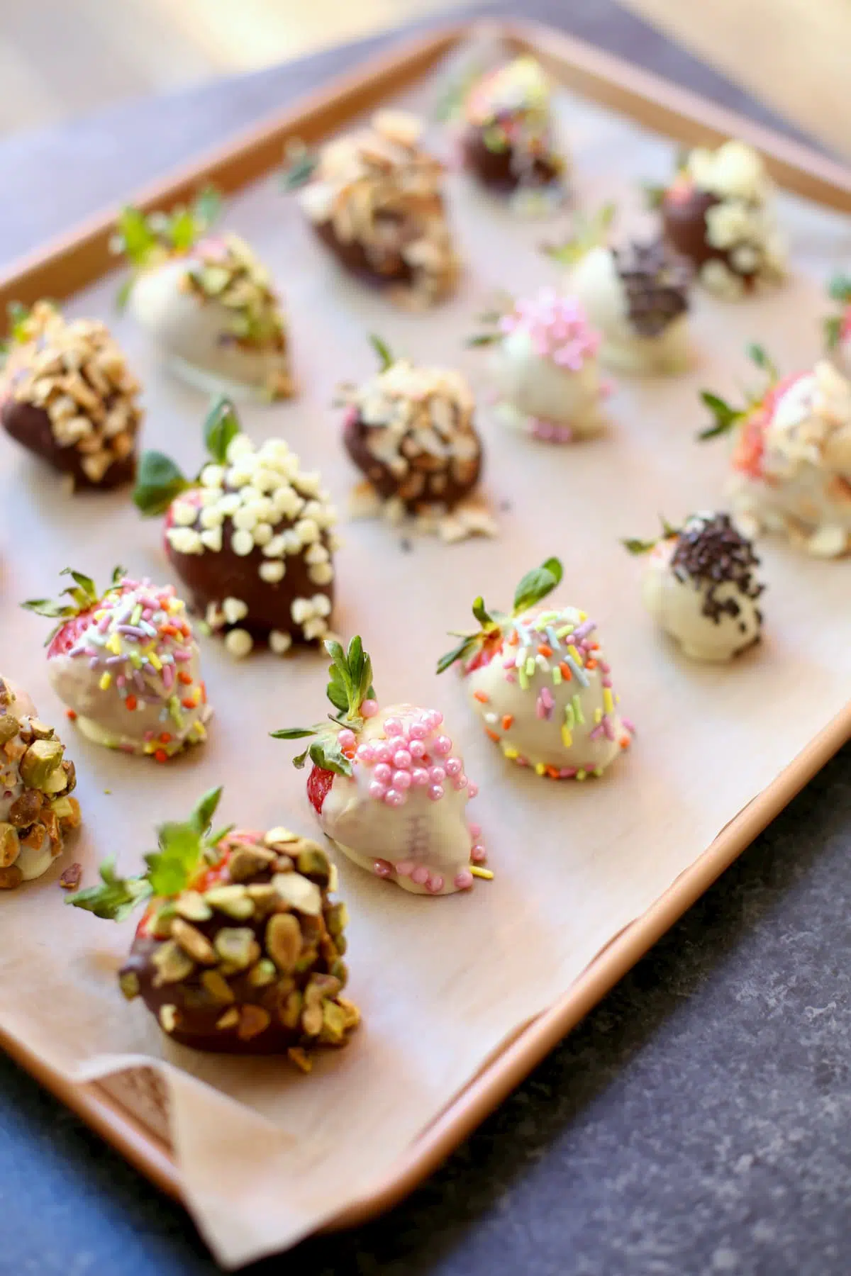 chocolate dipped strawberries on a baking sheet 