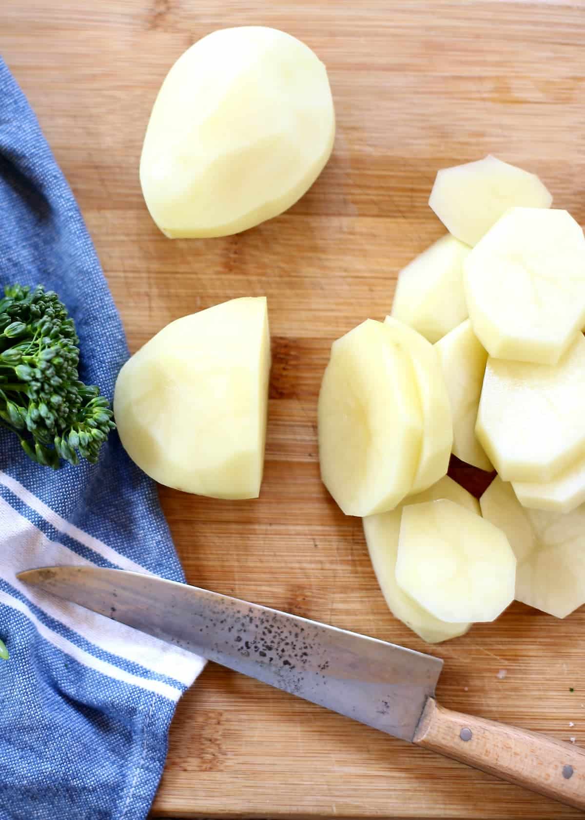 a process photo of potatoes being cut.