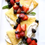berry crepes on a white platter