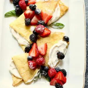 a platter of fruit crepes.