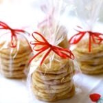 snickerdoodles in cellophane bags with red ribbons