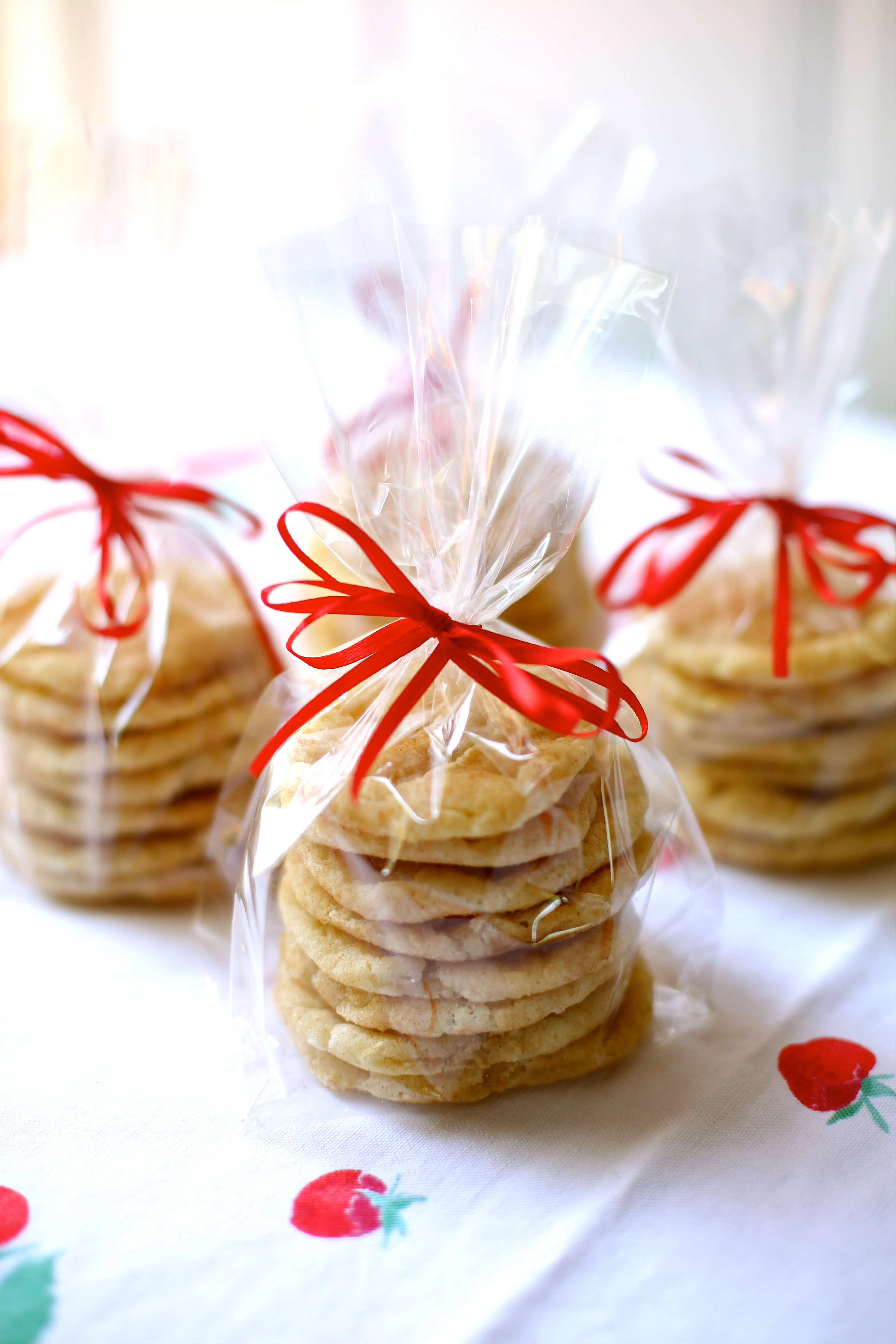 cookies in cellophane bags with red ribbons