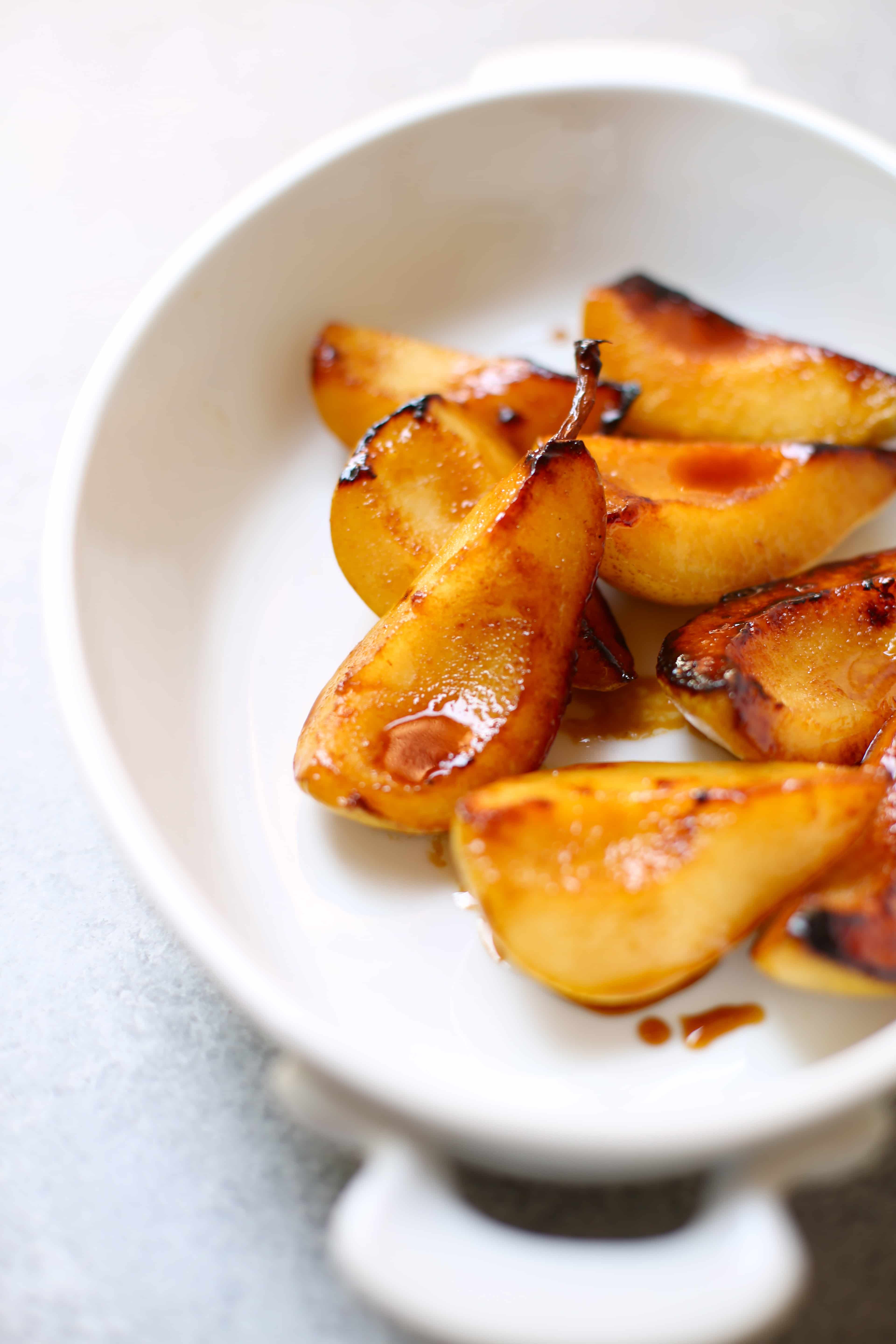 Pan Roasted Pears in a white serving dish 