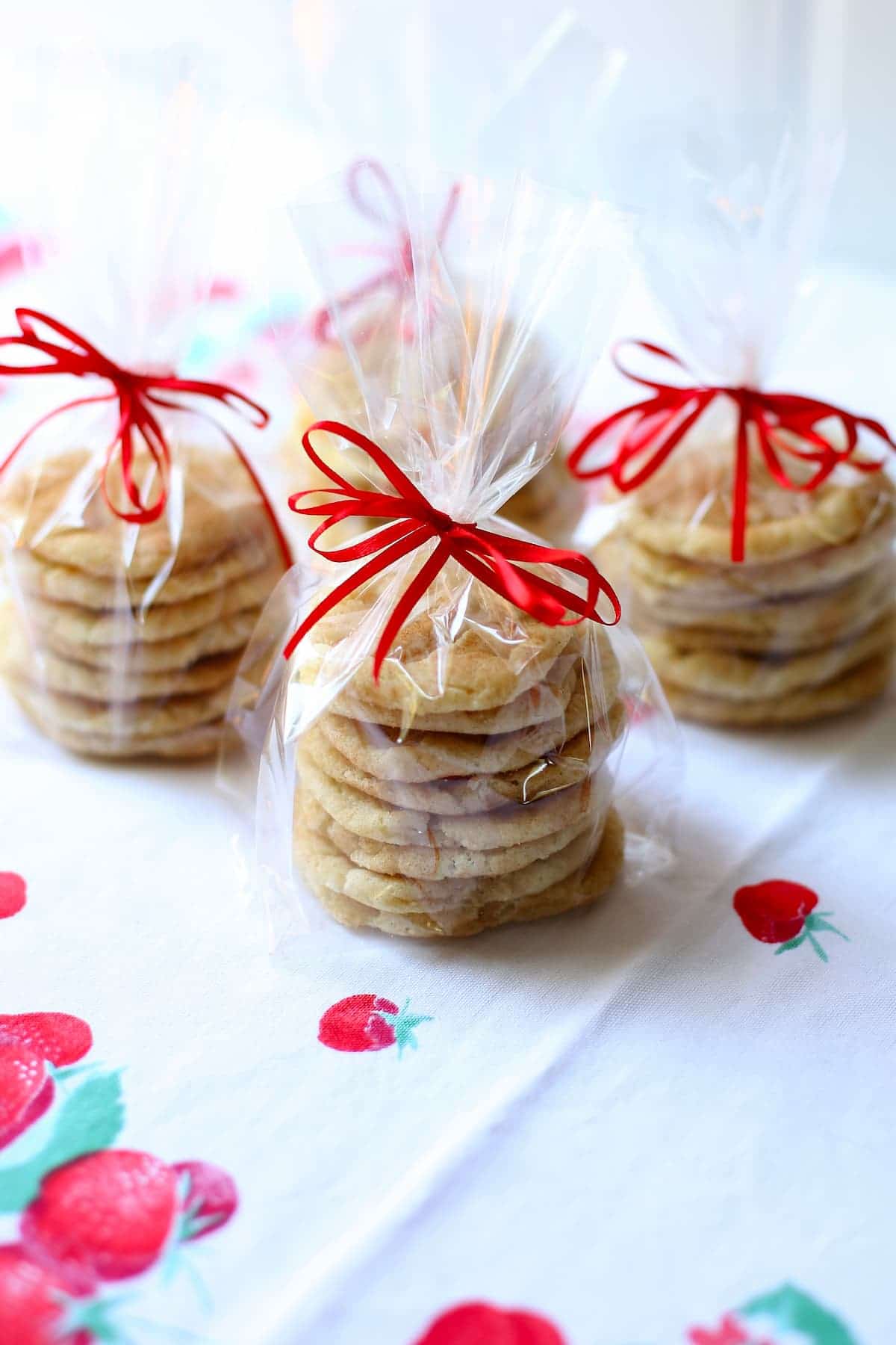 a table with wrapped snickerdoodle cookies.  