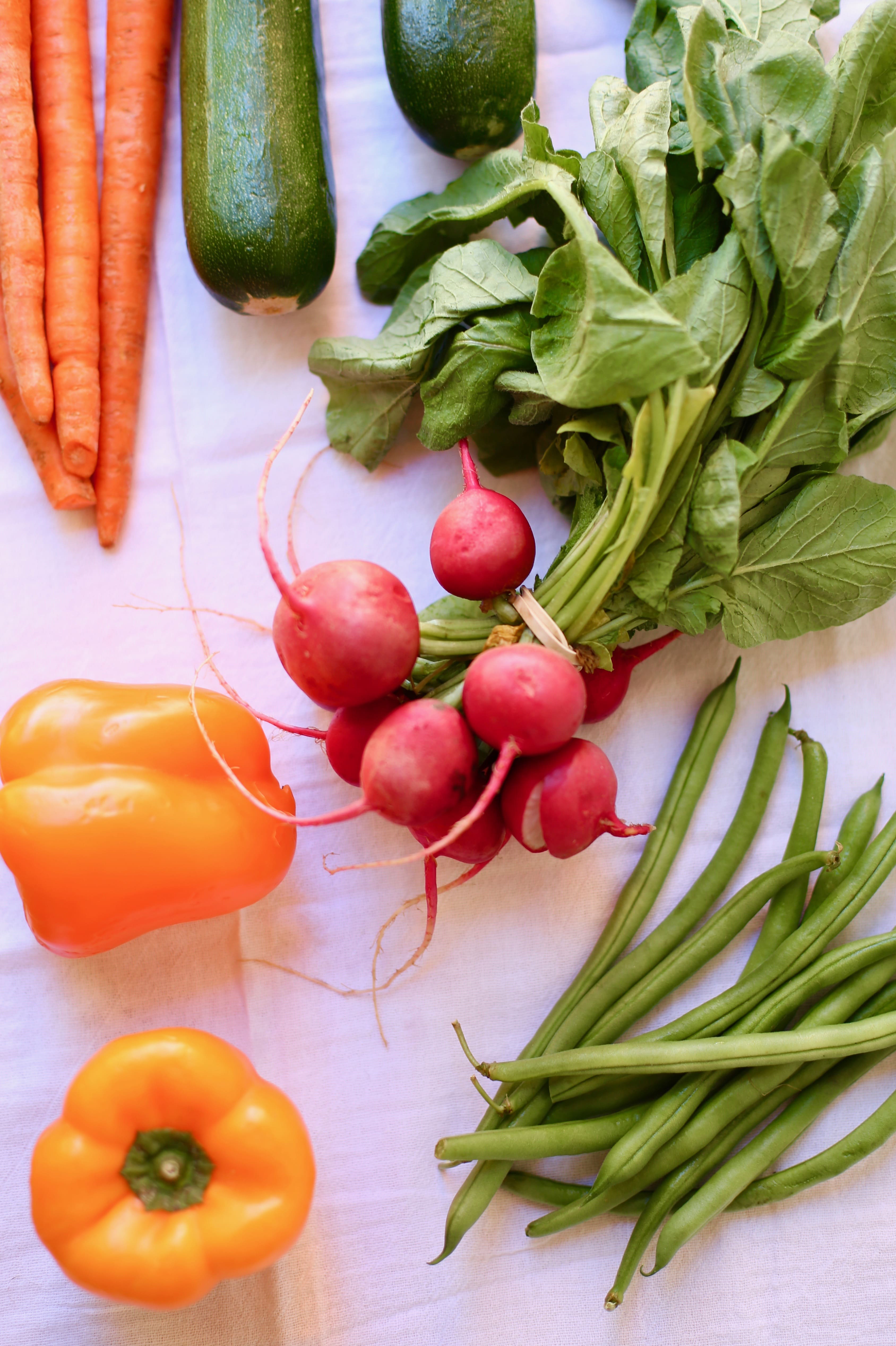 veggies on a cutting board, radishes