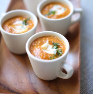 Three cups of Creamy Pumpkin Soup By Studio Delicious