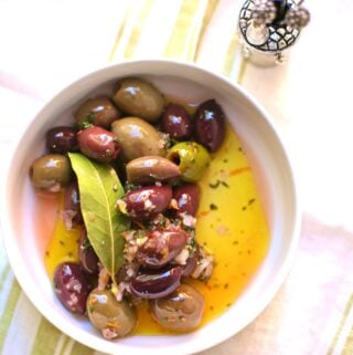 Festive Party Olives in a white bowl by Studio Delicious.com