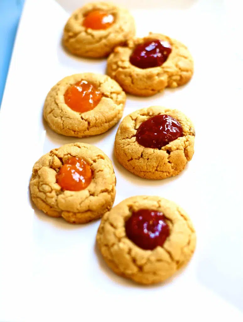 Cookies with jam on a white platter