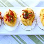 deviled eggs on a white tray