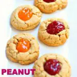 cookies on a white plate with jam and text