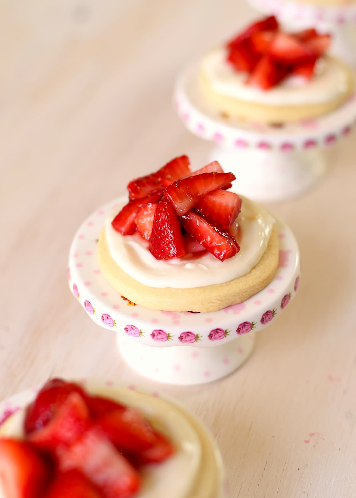 a few strawberry cheesecake cookies on a table.