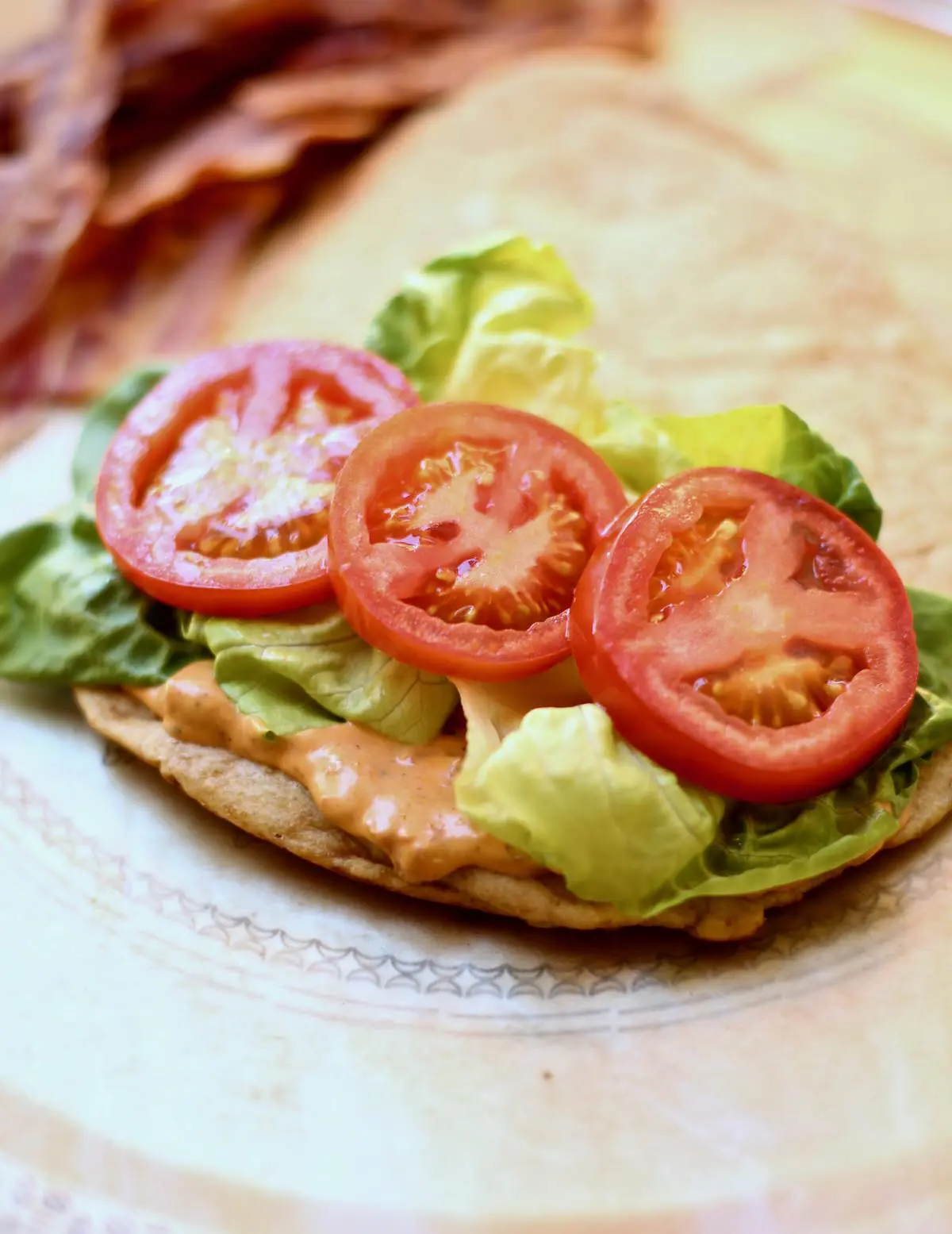 an open face sandwich with tomatoes