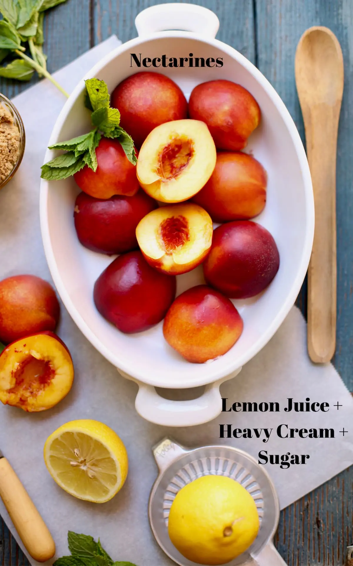 nectarines in a white bowl and wooden spoon next to it.  Lemons cut and mint and other cut nectarines sitting by. Text overlay on top saying what these ingredients are.  