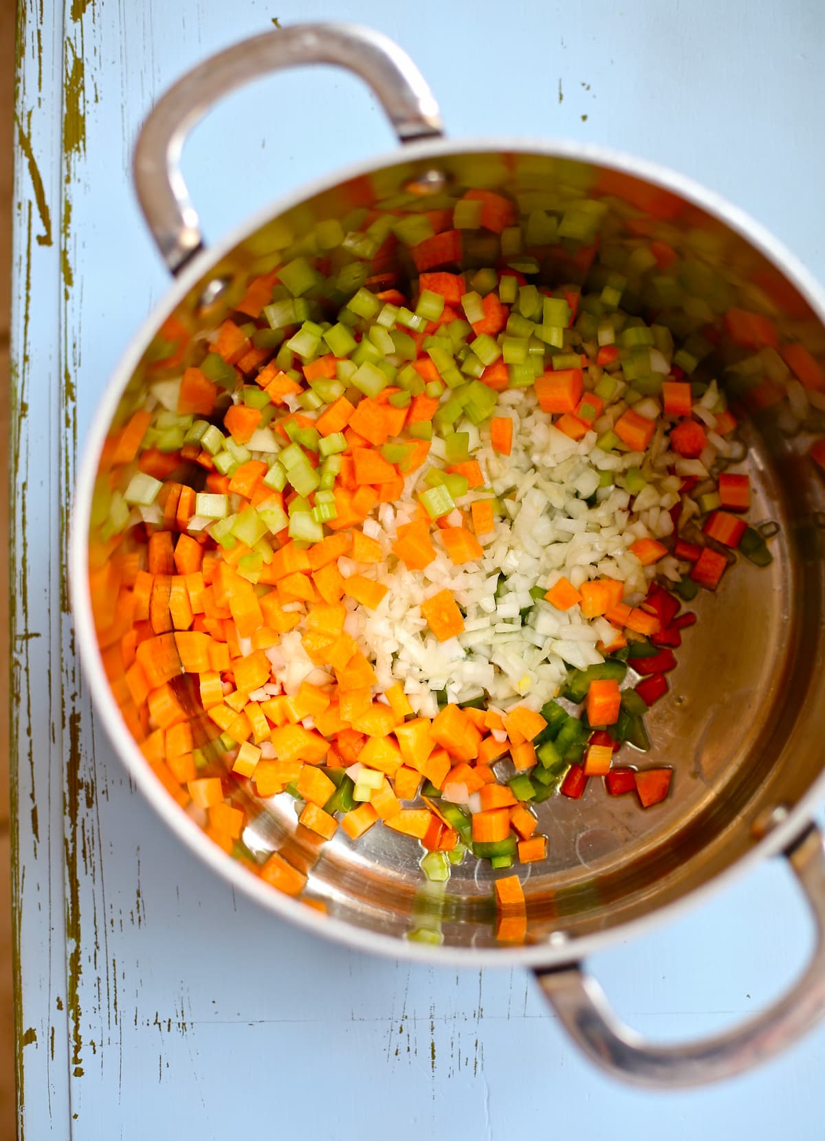 a dutch oven with carrots celery and onion for saute. 