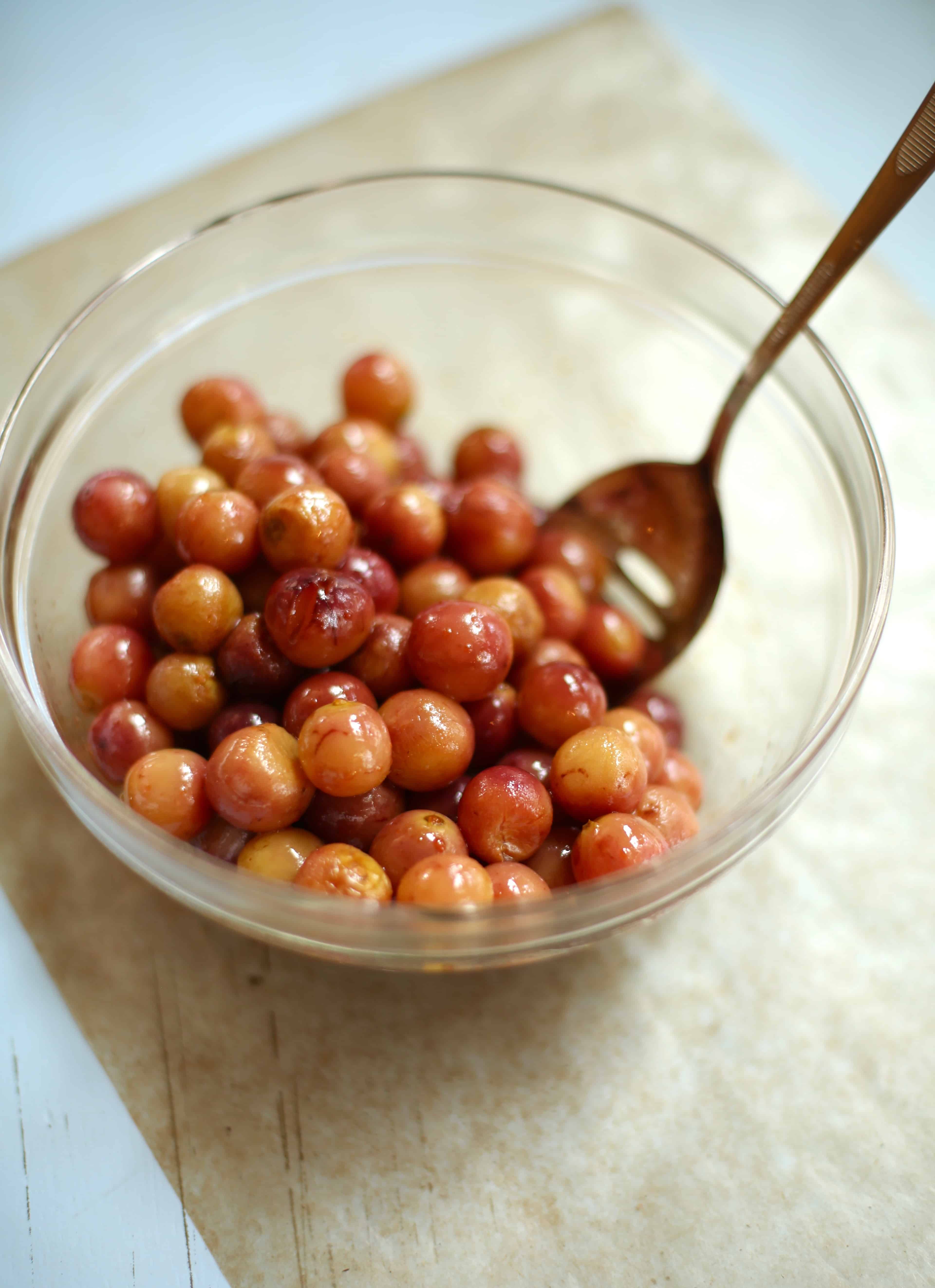 grapes in a glass bowl with spoon