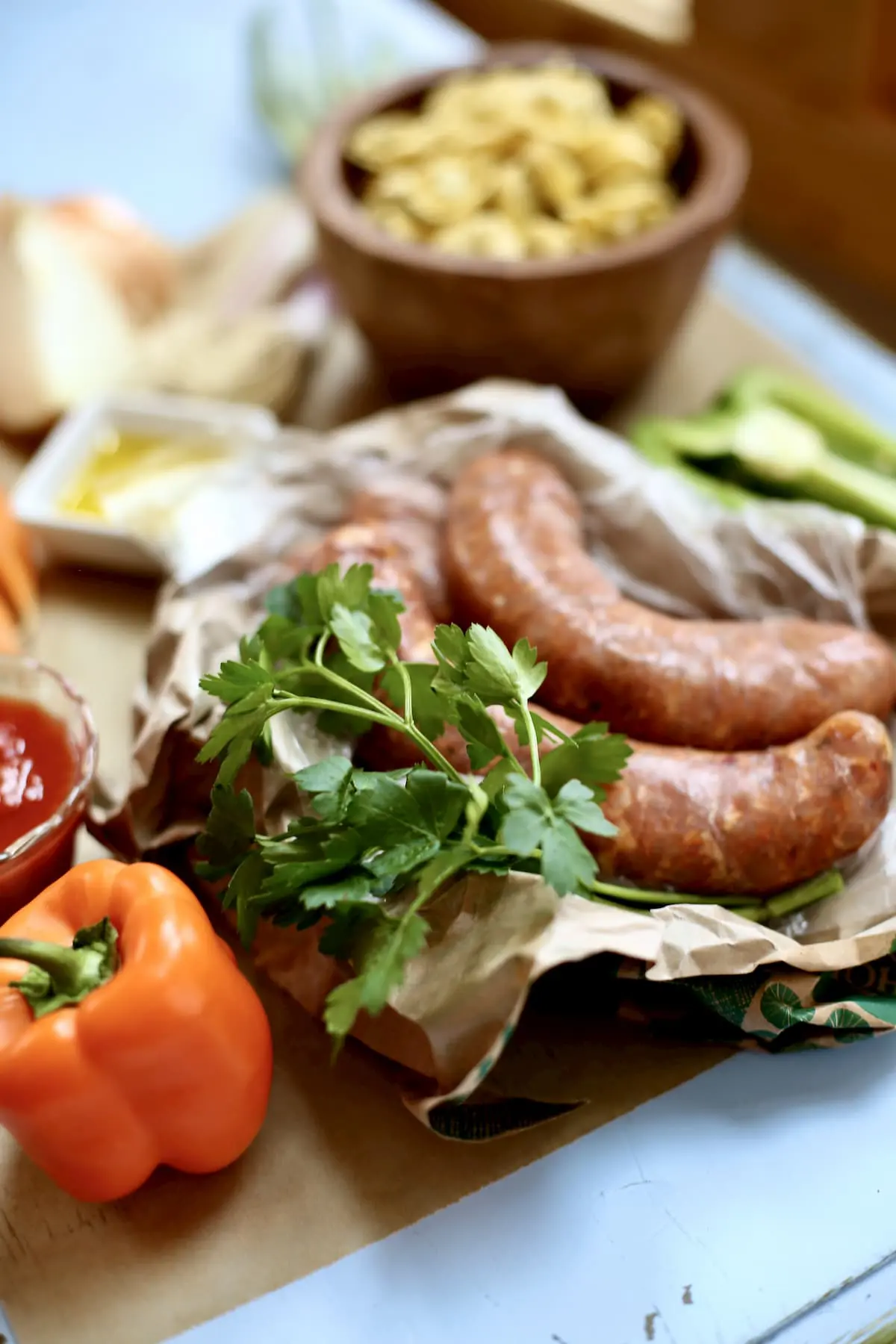 a table of sausage and vegetables to make soup from