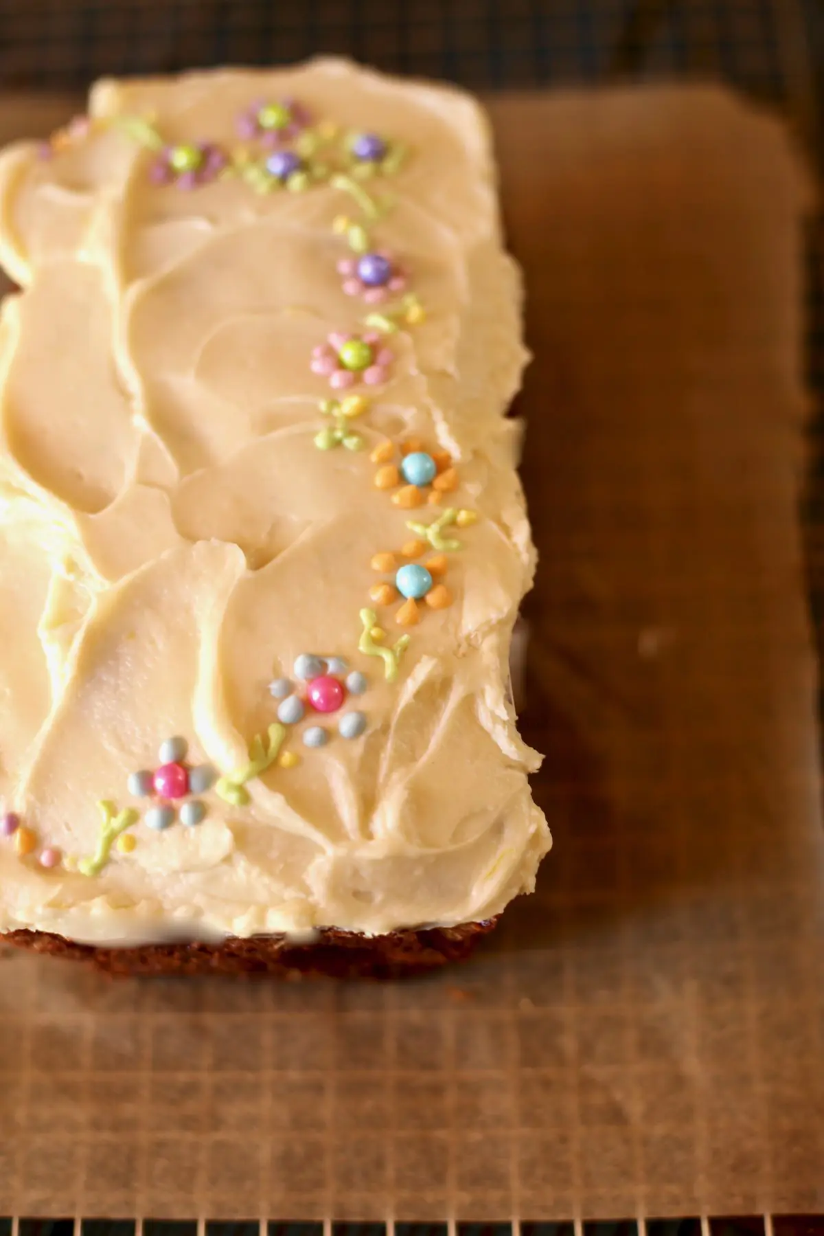 Banana Bread on a table with small flowers on top