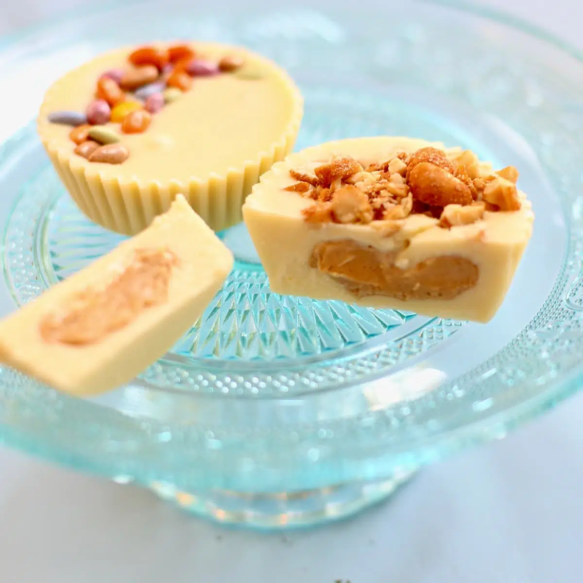 a blue tray of white chocolate peanut butter cups.
