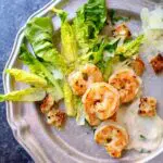 a plate of salad with the name in text on the top, Lemon Shrimp Salad