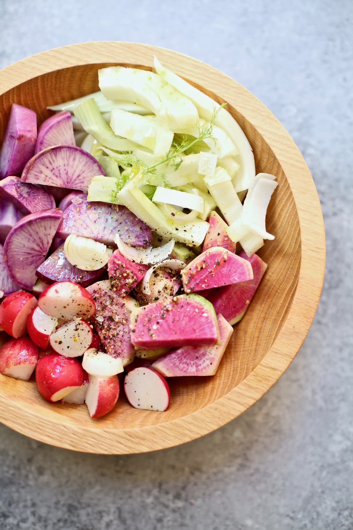 cut vegetables in a wooden bowl