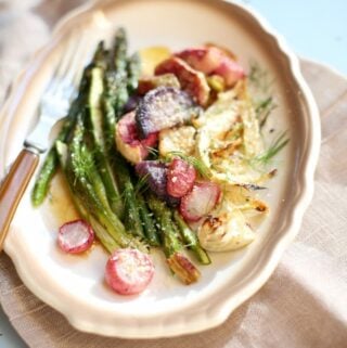 vegetables on a white plate with brown trim