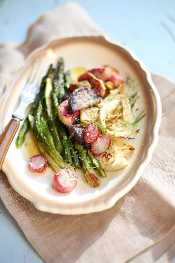 vegetables on a white plate with brown trim