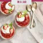 Three strawberry desserts in a jar with three spoons