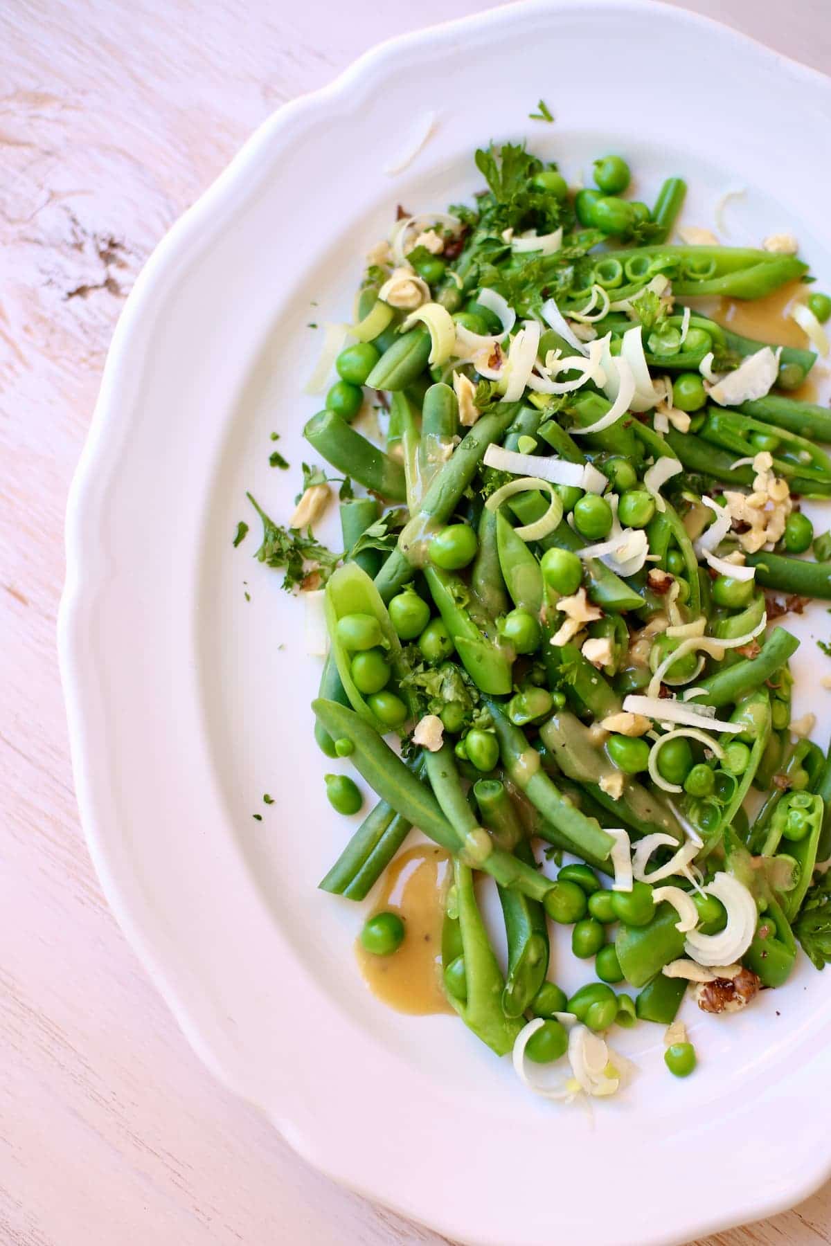 a close up photograph of a bean and pea salad.