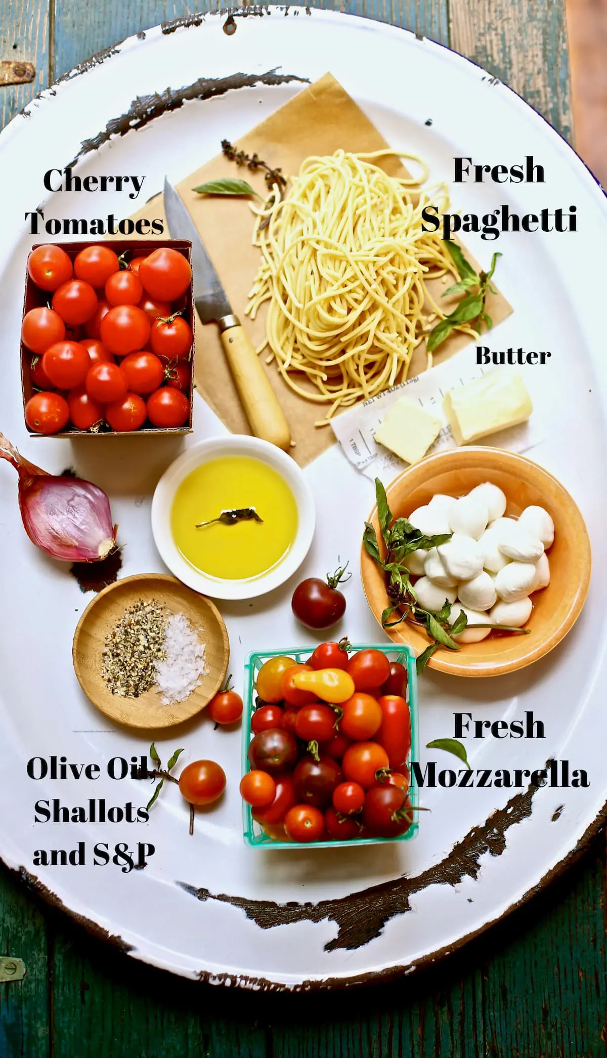ingredients for pasta on a white platter