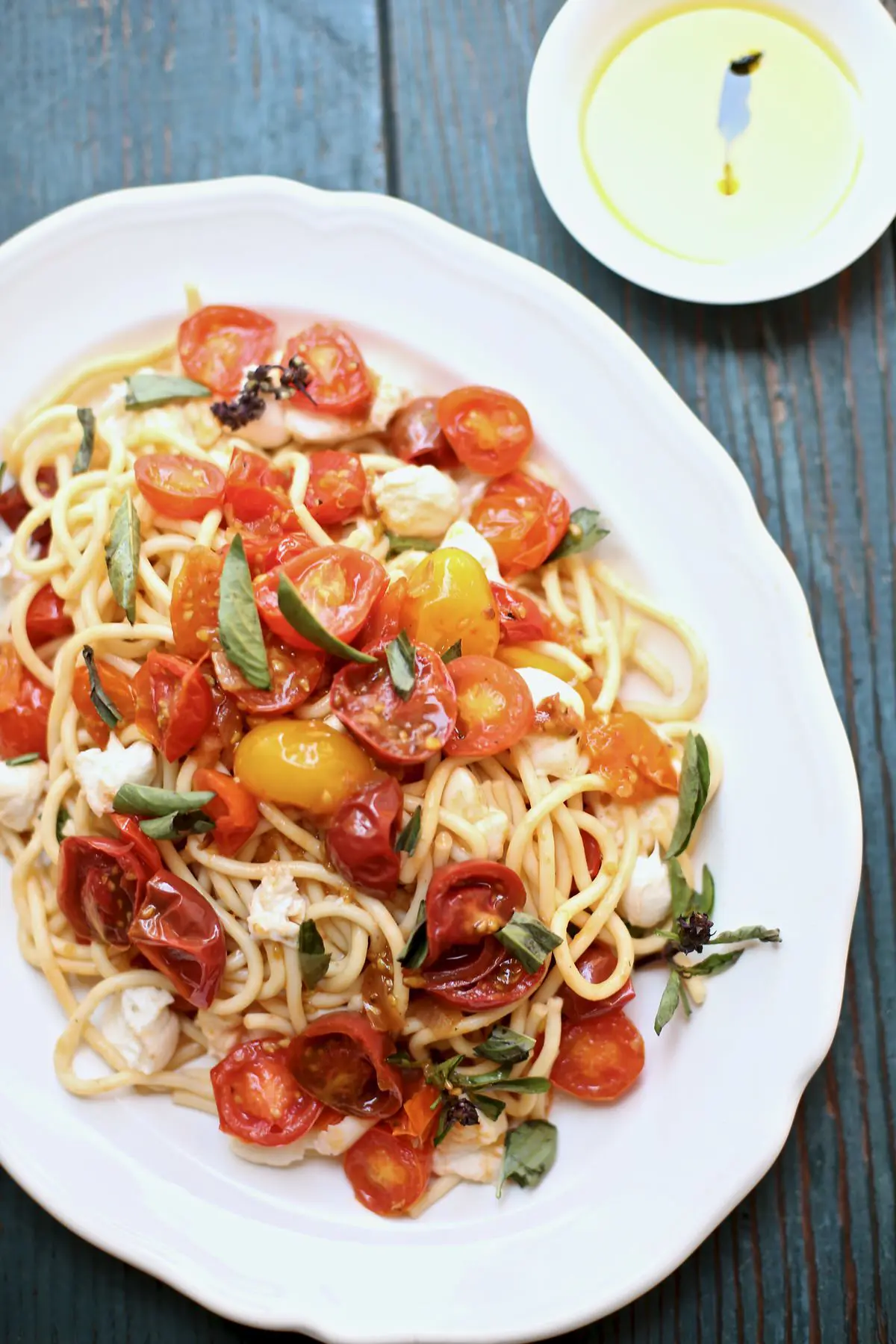 pasta on a white plate and blue table