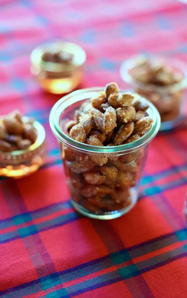 a photo of almonds on a red table cloth.