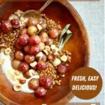 a wooden bowl with grapes and grains and yogurt, text overlya says the recipe name