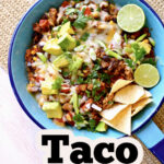 a skillet of food with text overlay called skillet taco bake.