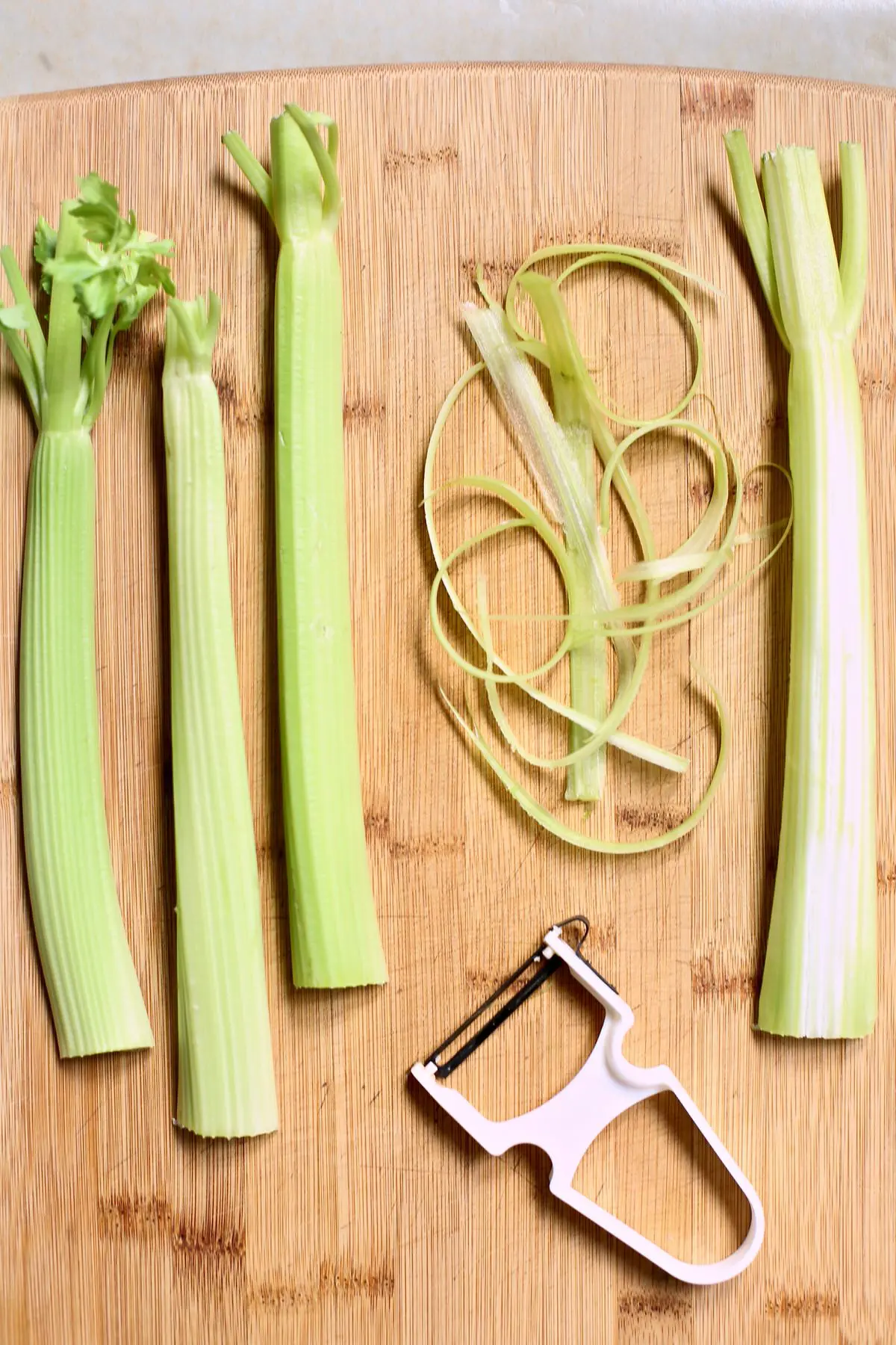 celery on a cutting board being shredded