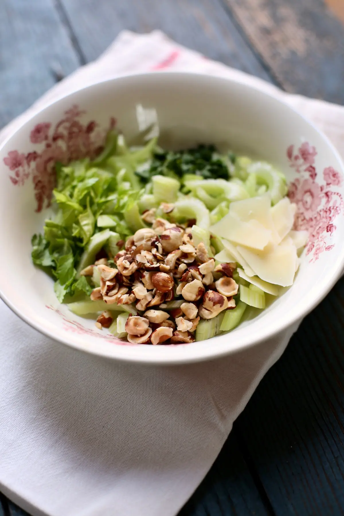ingredients for a celery salad in a bowl